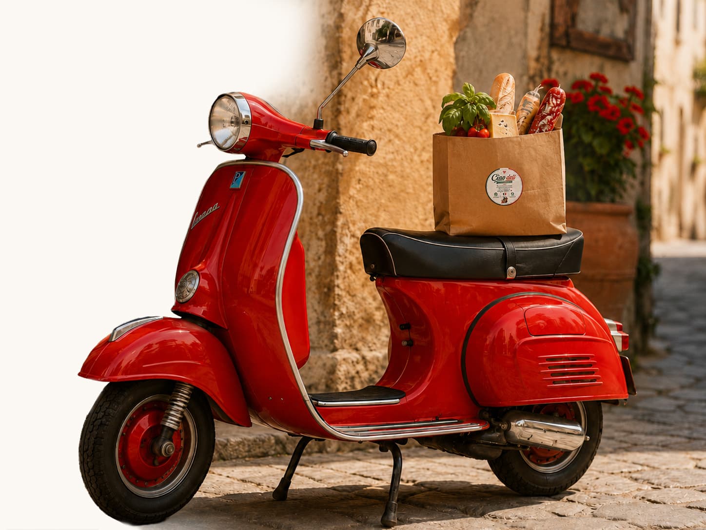 Röd Vespa med italienska delikatesser i en papperspåse